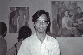 Huang Rui standing in front of his works, taken in 1981.